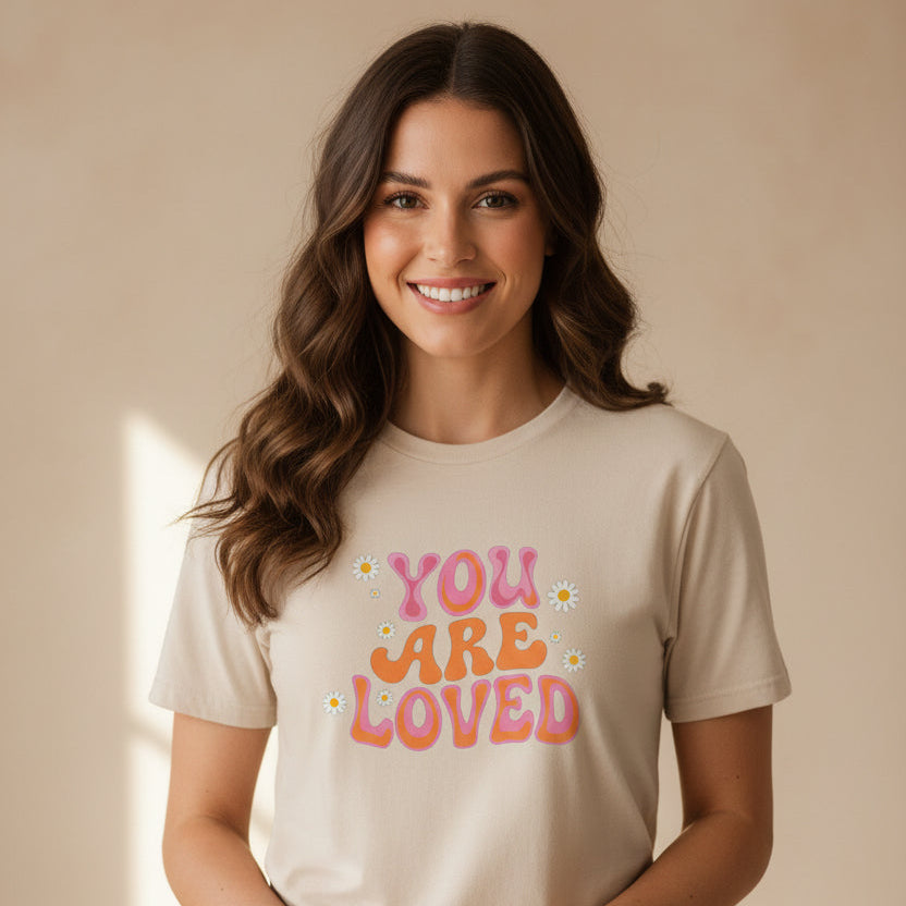 Woman wearing natural ‘You Are Loved’ T‑shirt.